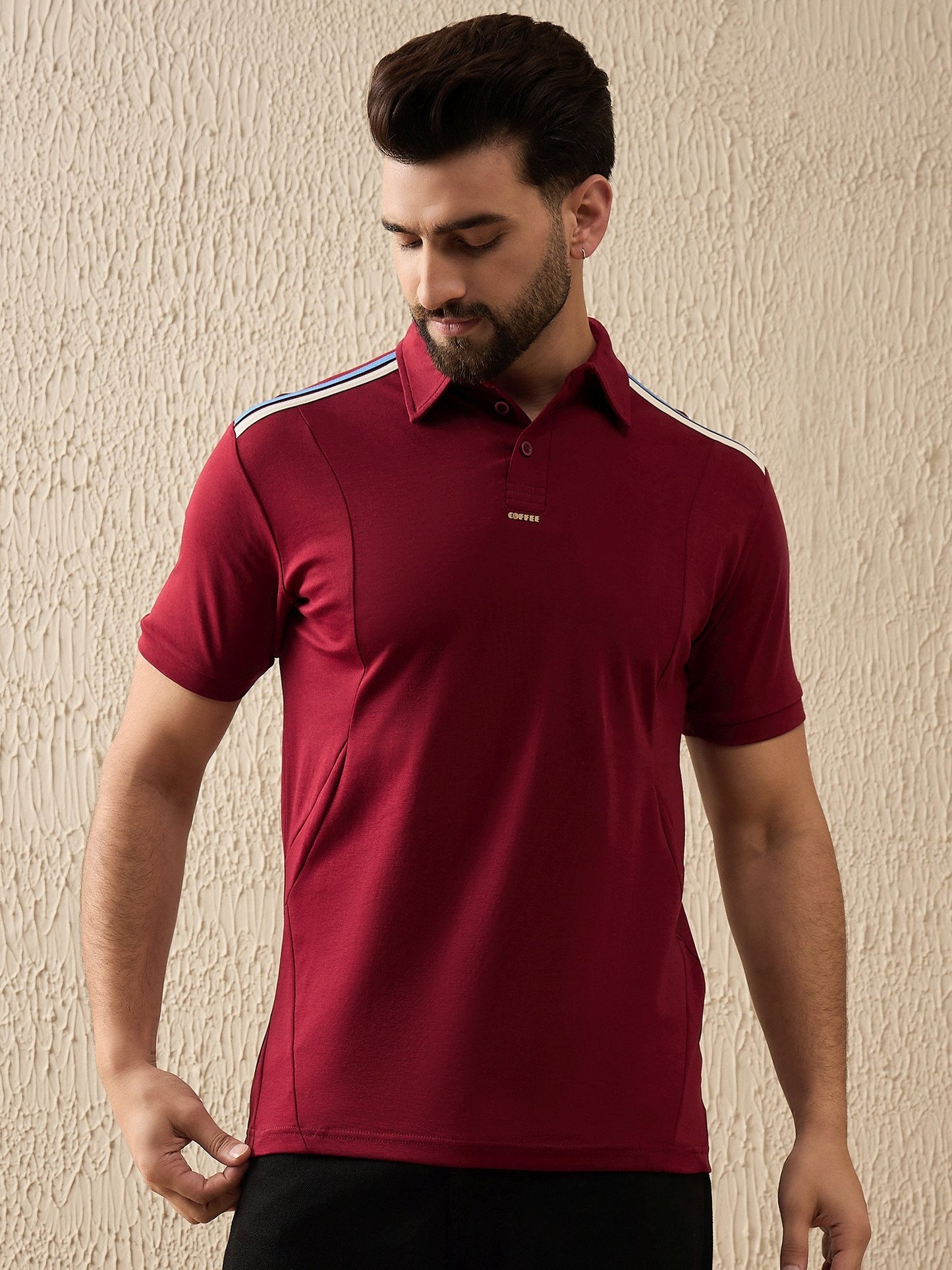 Maroon premium polo shirt featuring eye-catching black shoulder stripes and sleek styling
