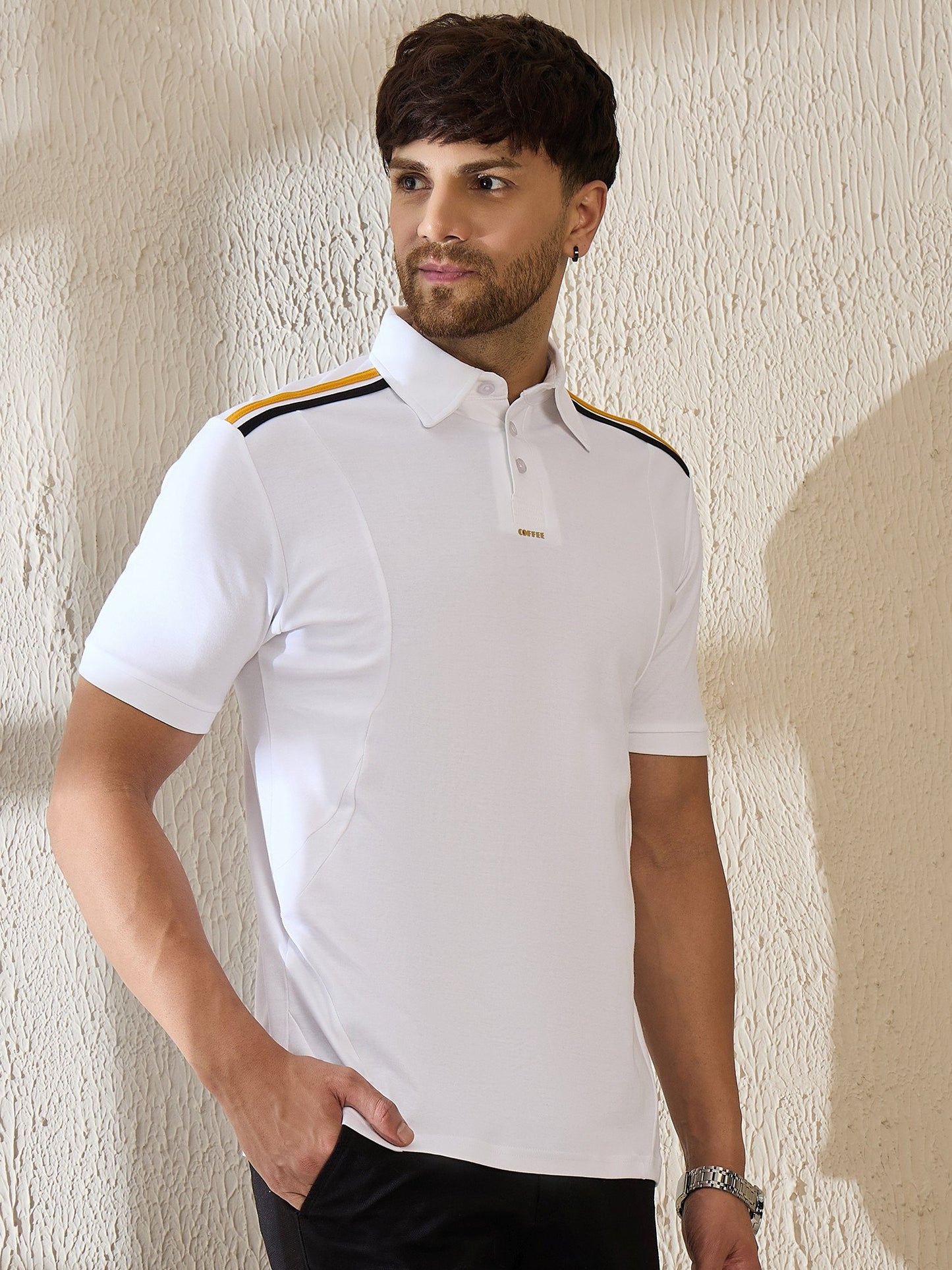 White premium polo shirt with bold black shoulder stripes for a sporty coffee-inspired look